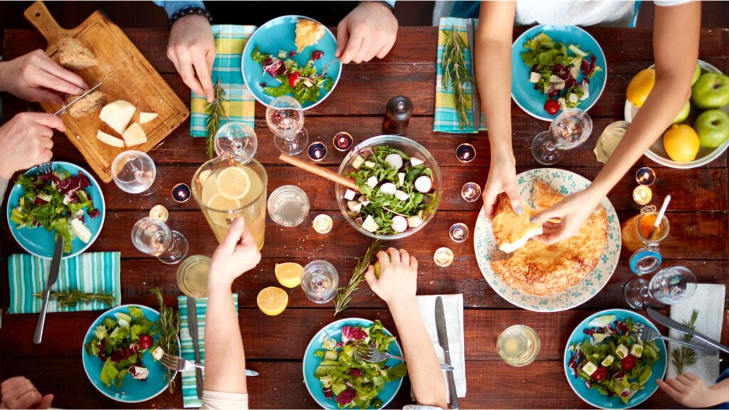 A family enjoying a meal. Picture by Canva